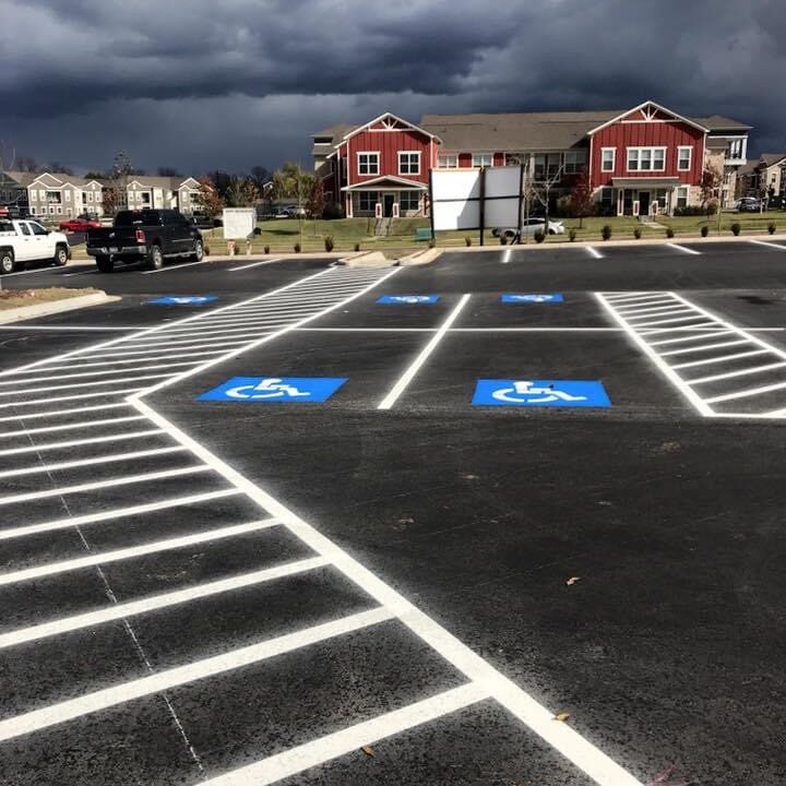 Freshly painted parking signs in white